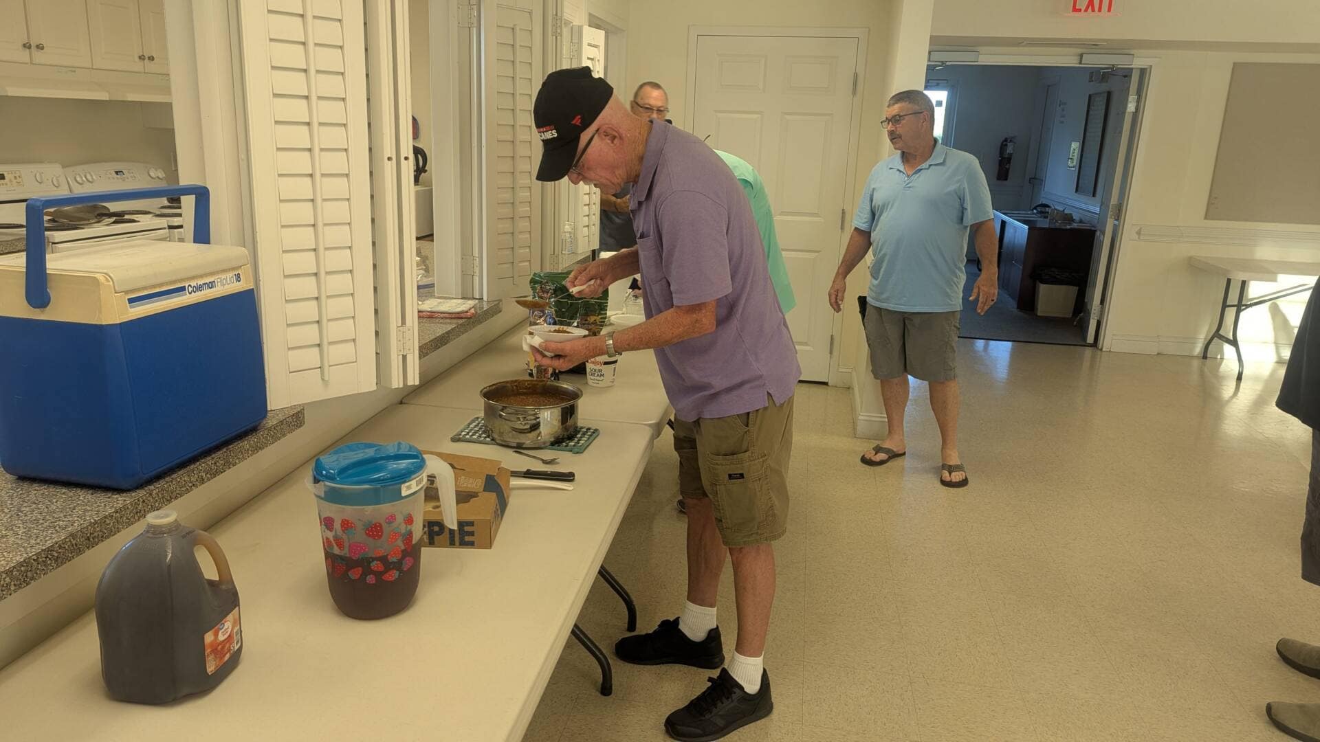 Church member serving himself the provided meal for Mens Ministry Meeting