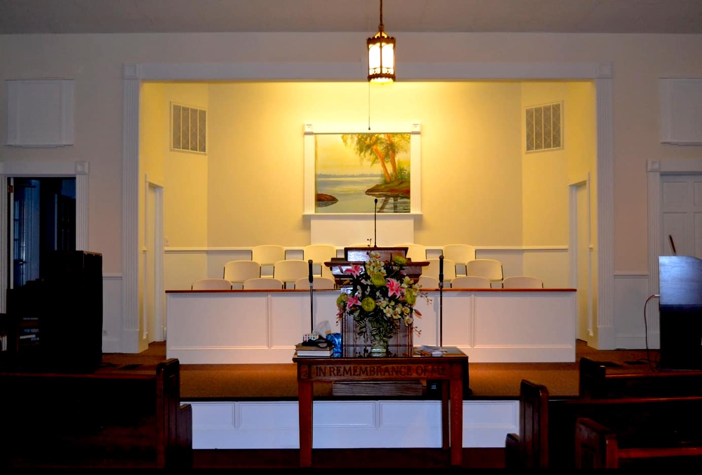 Sanctuary pulpit and choir area at Rawls Baptist Church after renovation, featuring updated design and improved worship space for the Fuquay-Varina congregation.