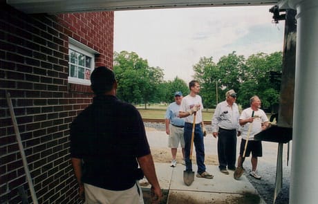 Volunteer Workday, 2005 Church members volunteering during final stages of construction at Rawls Baptist Church, working on landscaping and finishing touches near the new front entrance.