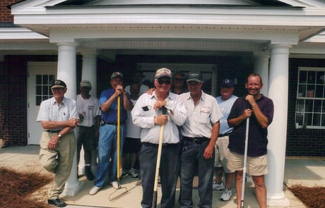 Men’s Work Crew, 2005 Group photo of Rawls Baptist Church members standing in front of the newly completed addition, marking the conclusion of the 2005 expansion project.