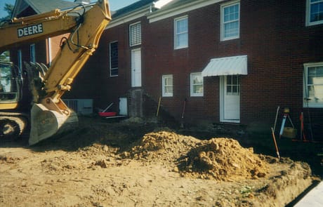 Preparing the Site, 2005 Excavation and grading underway beside Rawls Baptist Church as crews prepare the foundation for the 2005 addition.