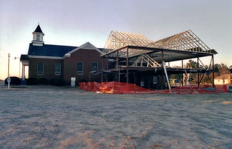 Roof Construction, 2005 The metal framework of the new building rising beside the existing sanctuary at Rawls Baptist Church in 2005.