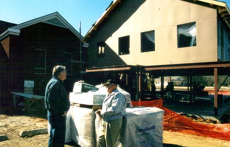 Supervising the Build, 2005 Wooden framing and exterior sheathing applied to the second story as the education and fellowship wing takes shape.