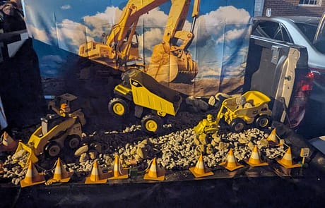 rawls_trunk_or_treat_2025_2 Rawls Baptist Church Trunk or Treat Construction Decorated Trunk with Toy Trucks and Gravel