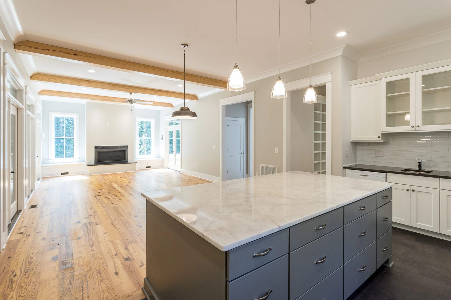 Open-concept kitchen and living area in a custom home in Holly Springs, North Carolina