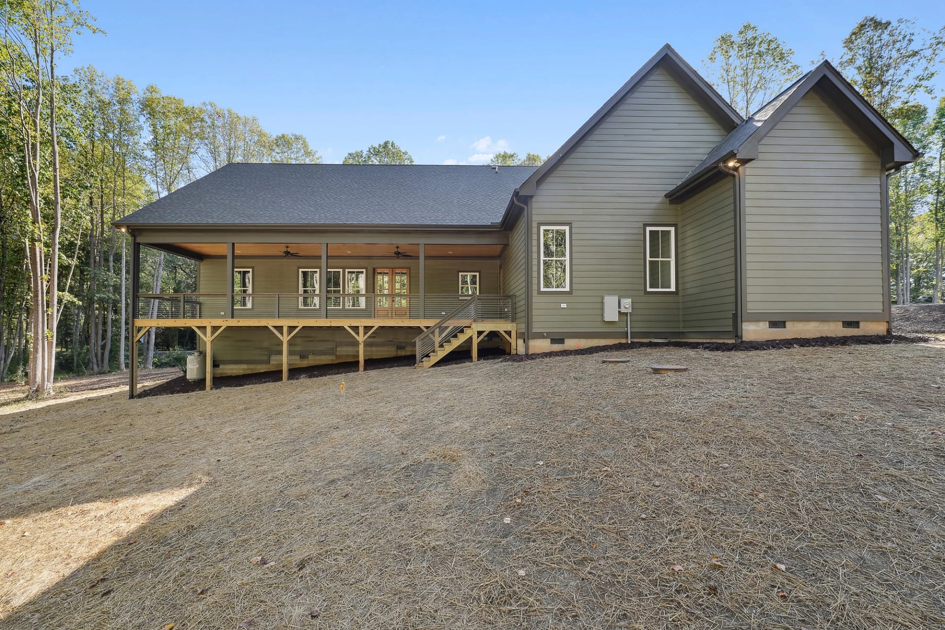 Exterior of a custom home with rear porch in Holly Springs, North Carolina