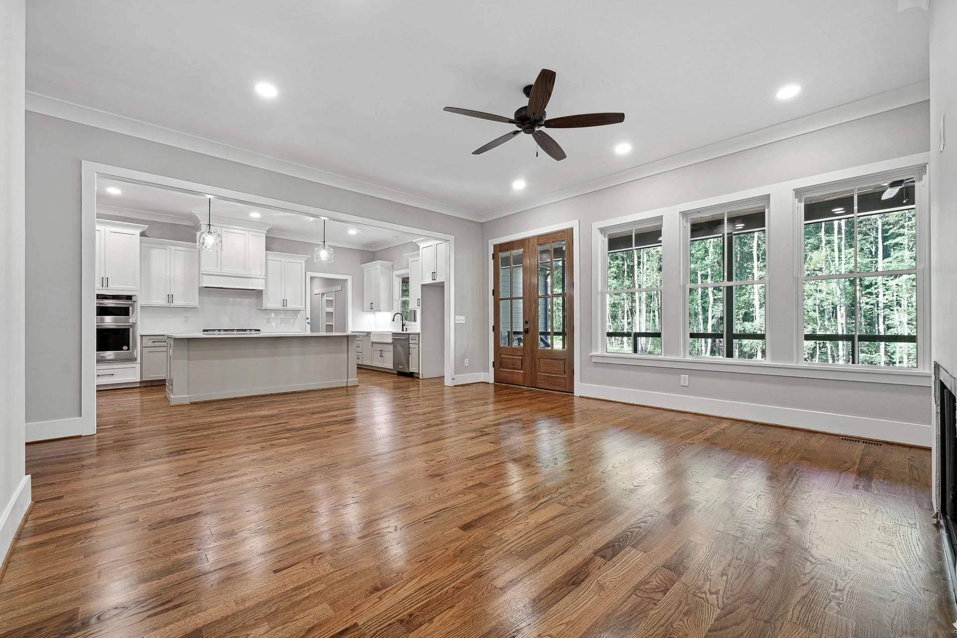 Open-concept kitchen and living area in a custom home in Holly Springs, North Carolina