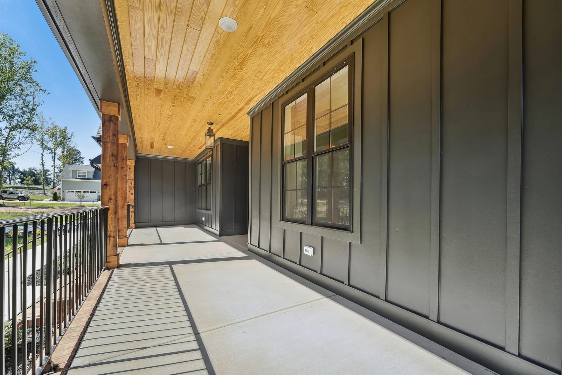 Covered front porch of a new construction home in Holly Springs, North Carolina