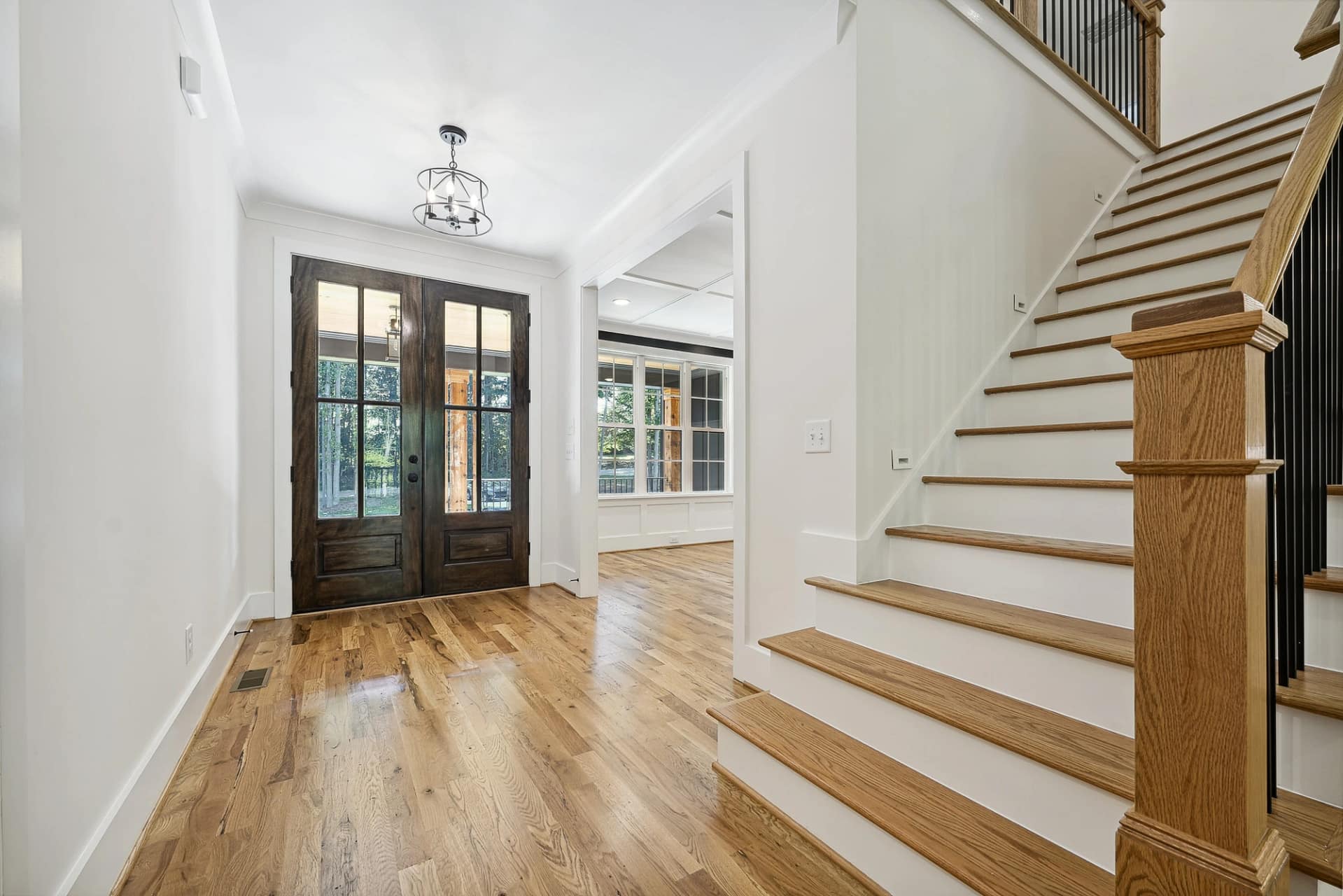 Staircase and foyer interior of a new construction home in Holly Springs, North Carolina