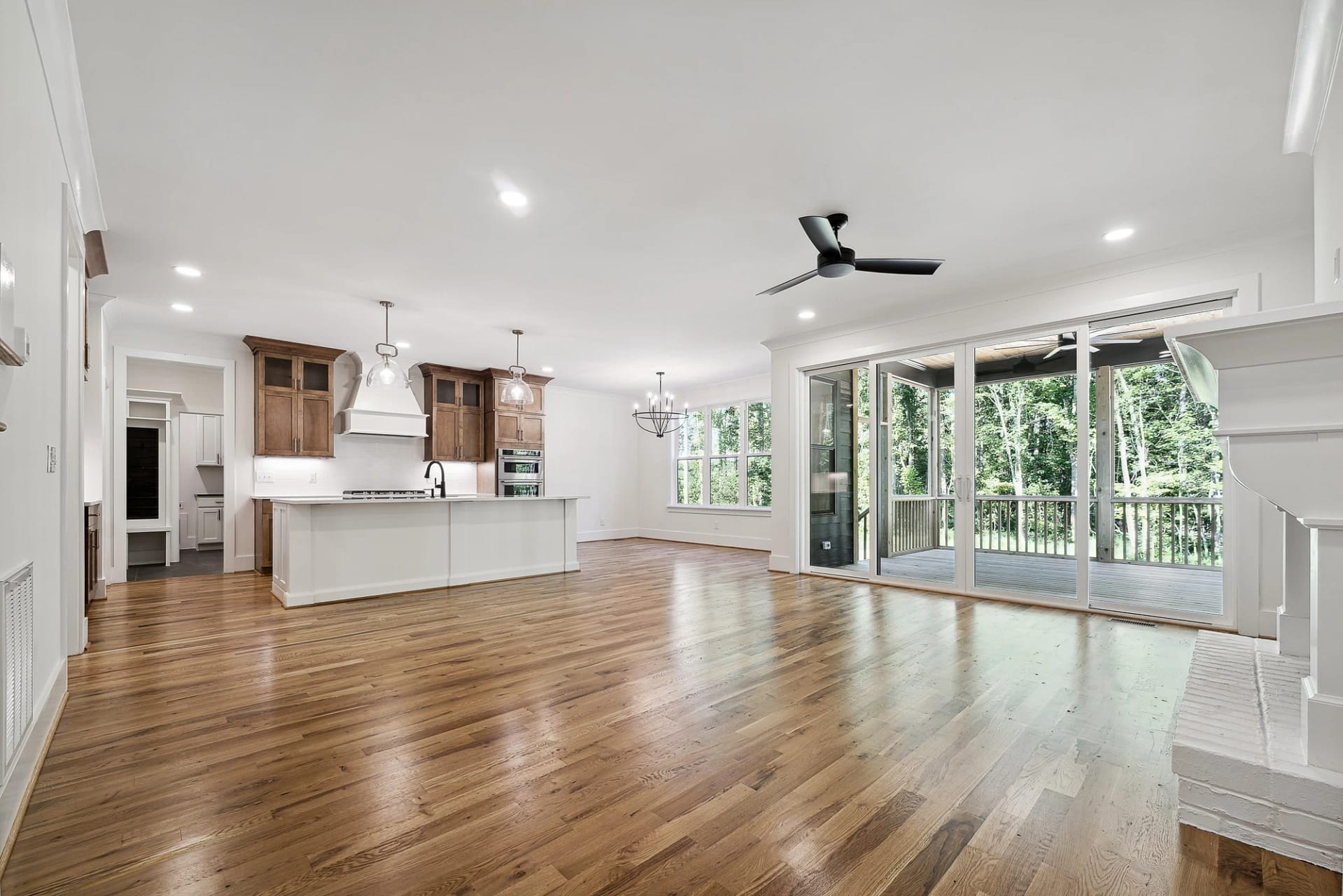 Open living area with kitchen and dining space in a new construction home in Holly Springs, North Carolina