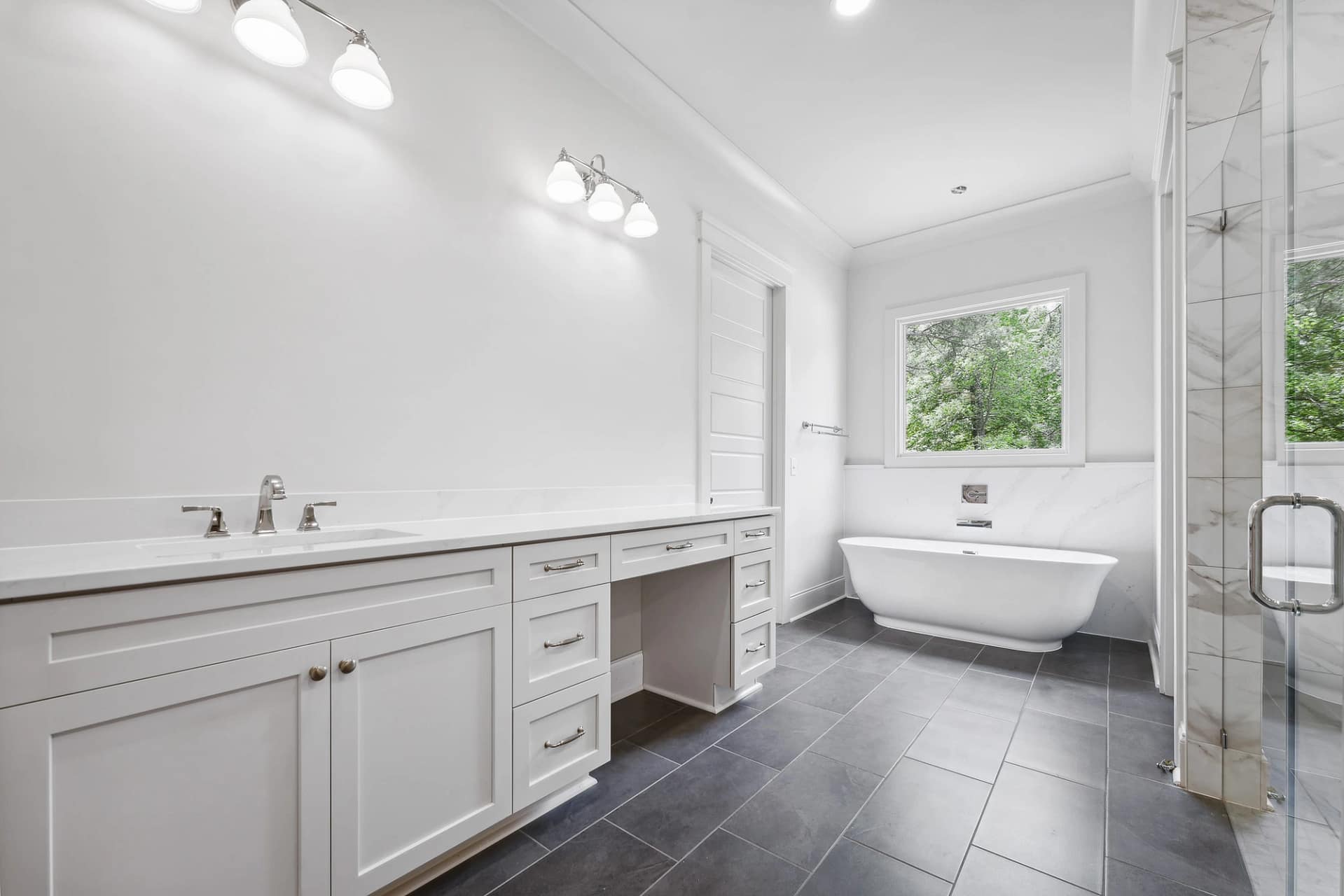 Double vanity bathroom with freestanding tub in Holly Springs custom home