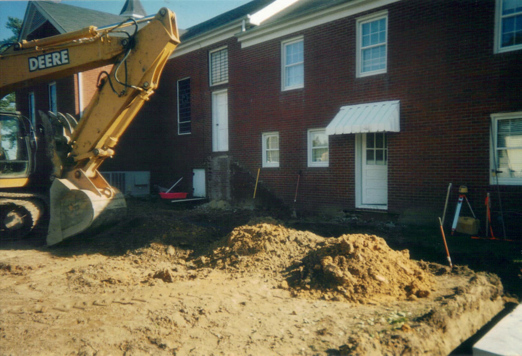 Preparing the Site, 2005 Excavation and grading underway beside Rawls Baptist Church as crews prepare the foundation for the 2005 addition.
