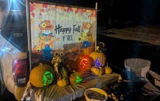 rawls_trunk_or_treat_2025_4 Rawls Baptist Church Trunk or Treat Happy Fall Y'all Banner with lit up Pumpkins