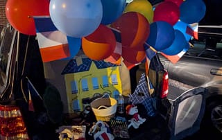 rawls_trunk_or_treat_2025_3 Rawls Baptist Church Trunk or Treat Decorated Trunk French Building with Balloons