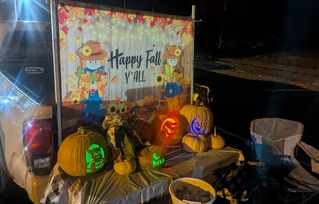 rawls_trunk_or_treat_2025_4 Rawls Baptist Church Trunk or Treat Happy Fall Y'all Banner with lit up Pumpkins