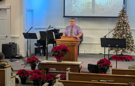 Donnie Simpson preaching at Rawls Donnie Simpson guest preaching at Rawls Baptist Church with Christmas decorated stage