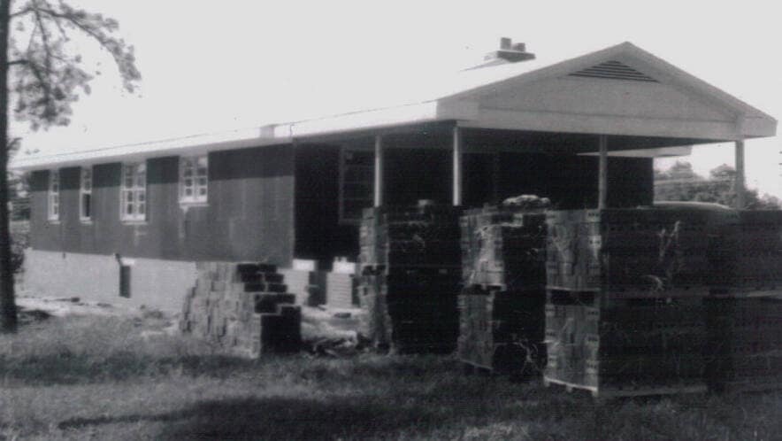Parsonage Under Construction — July 1960 Construction of the Rawls Baptist Church parsonage in Fuquay-Varina, NC, during July 1960, showing progress and congregation involvement.