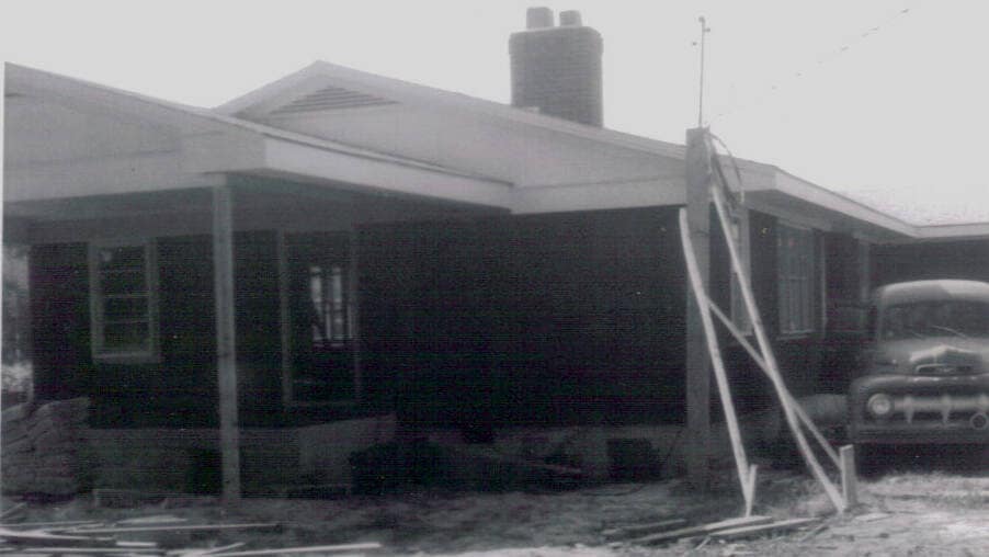 Front Porch and Roof Framing Progress Construction of the Rawls Baptist Church parsonage in Fuquay-Varina, NC, during July 1960, showing progress and congregation involvement.