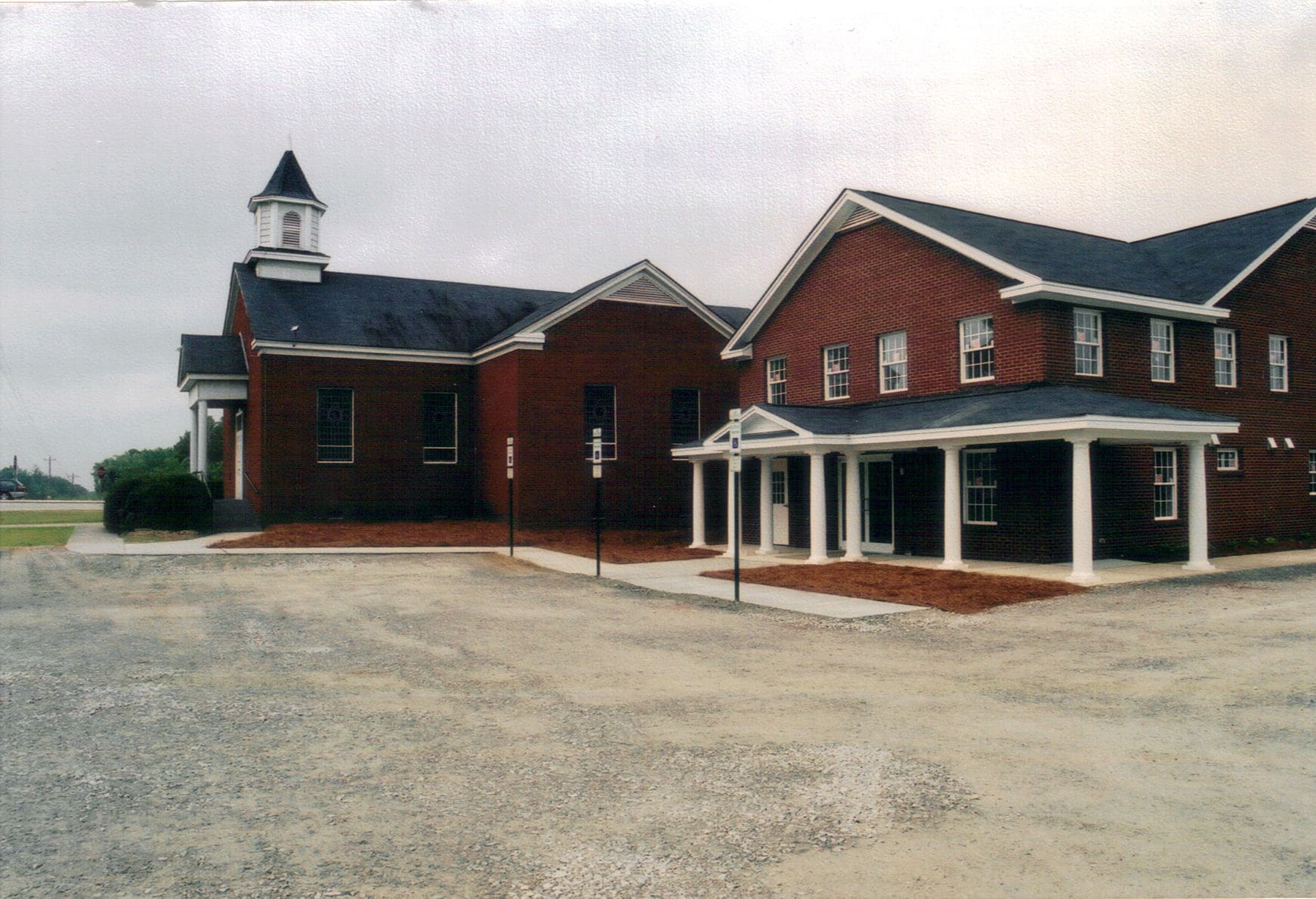 Completed Addition, 2005 Exterior of the Rawls Baptist Church addition in Fuquay-Varina, NC after construction with brick and landscaping.