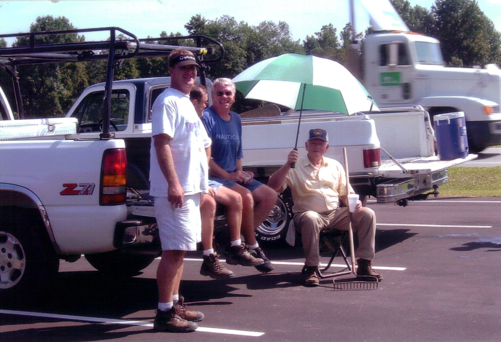 Taking a Break Together, 2005 Rawls Baptist Church volunteers relaxing in the parking lot after a day of work during the 2005 expansion project.