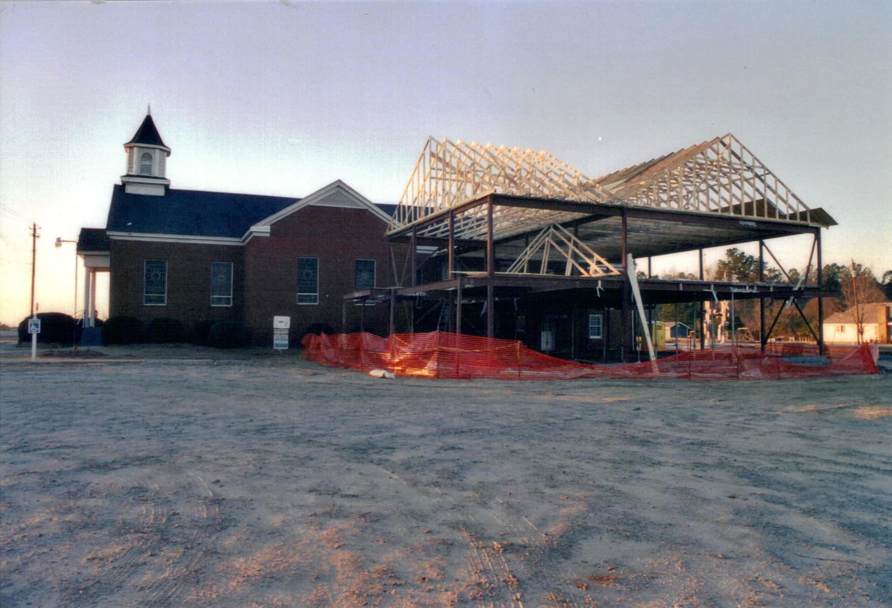 Roof Construction, 2005 The metal framework of the new building rising beside the existing sanctuary at Rawls Baptist Church in 2005.