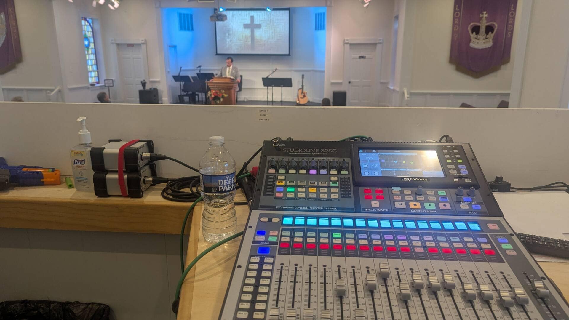 Sound booth at Rawls Baptist church showing a soundboard overlooking the congregation in the sanctuary