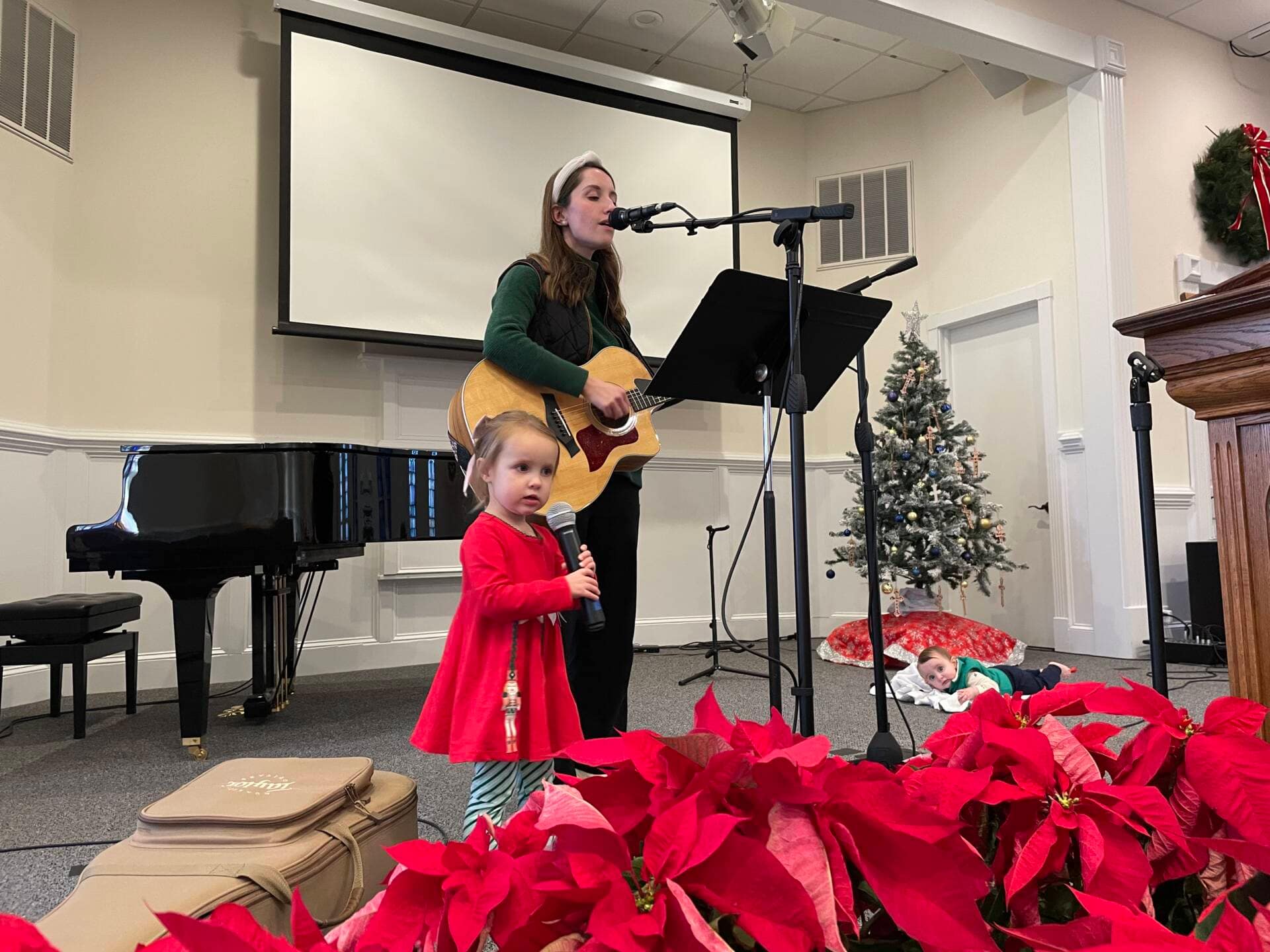 Susanna Gaster leader of the Praise Team singing at Christmas Service