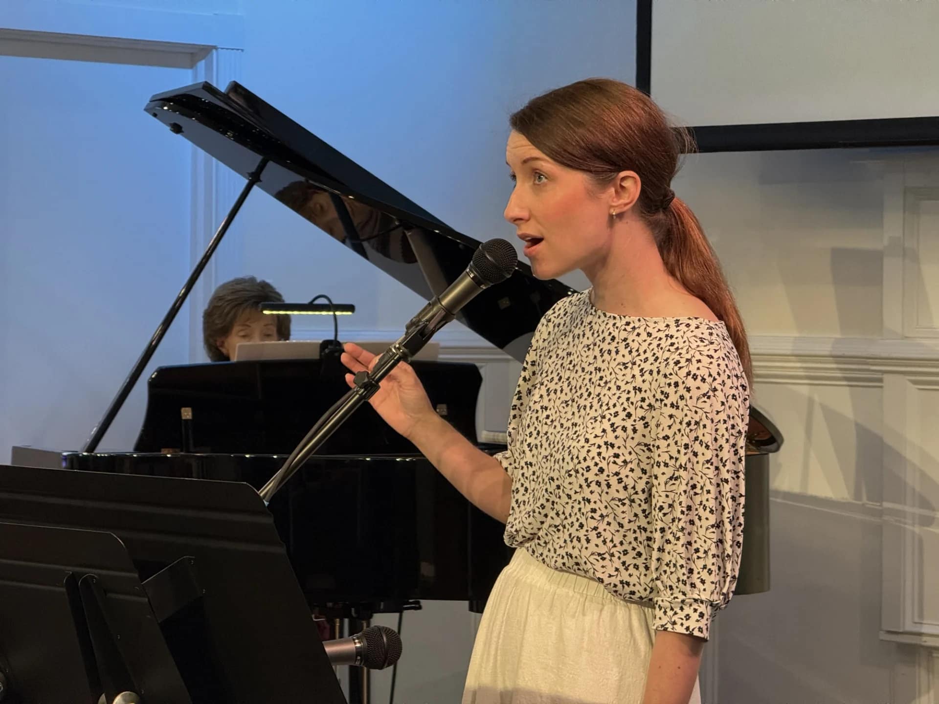 Susanna singing during Sunday Service with Praise team