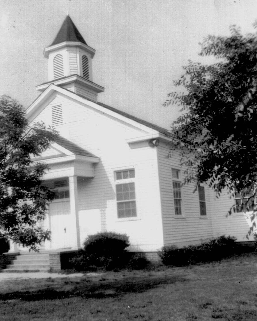 1962 – Rawls Church Before Brick Rawls Baptist Church sanctuary before the brick veneer renovation in Fuquay-Varina, NC, showing the original wooden exterior, 1962.