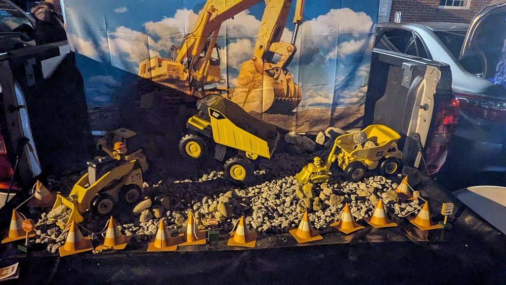 Rawls Baptist Church Trunk or Treat Construction Decorated Trunk with Toy Trucks and Gravel