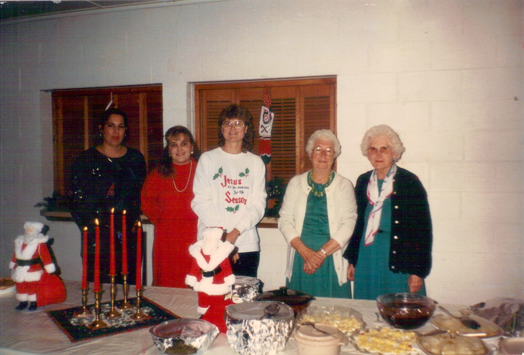 Older women standing in christmas outfits for WMC Supper in 1992 at Rawls Baptist Church